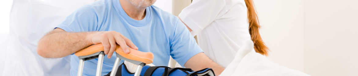 Hospital - female nurse take care of patient with broken leg