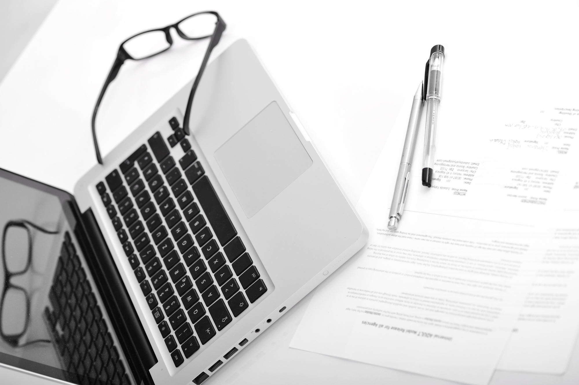 Laptop and agreement documents, contract for signing